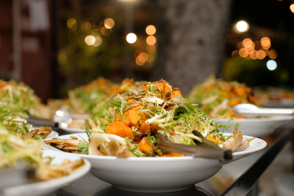 Frisee salad with butternut squash, wild mushrooms, and pumpkin seeds. 