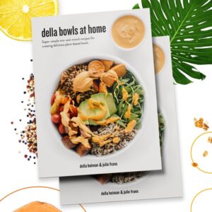 cover of della bowls at home cookbook shows a colorful bowl layered with grains, vegetables, seeds and the delicious Red Sauce